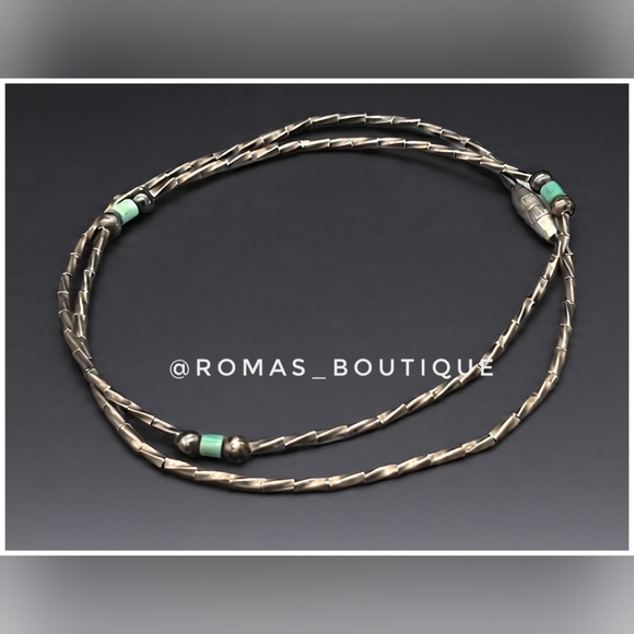Vintage liquid silver necklace with turquoise beads.
